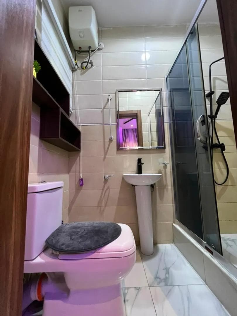 Bathroom with a walk-in shower and vanity mirror